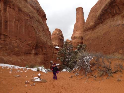 Erin Alberty  |  The Salt Lake Tribune

A hiker gets ready to explore a jungle of rocks on the Broken Arch Loop hike at Arches National Park.