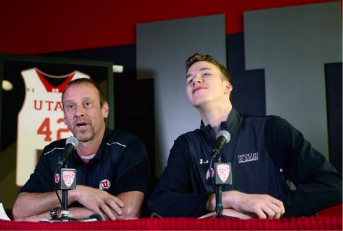 Scott Sommerdorf   |  The Salt Lake Tribune  
Jakob Poeltl cranes his neck as he acknowledges team mates entering to watch the press conference as he announced that he's decided to enter the NBA Draft. Utah head coach Larry Krystkowiak joined him in the press conference at the Utah practice facility, Wednesday, April 13, 2016.