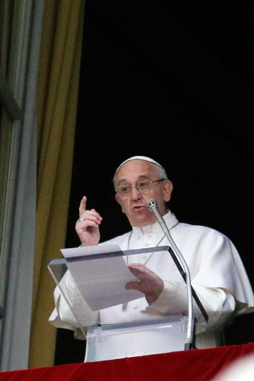 Pope Francis delivers the Regina Coeli prayer from his studio's window overlooking St. Peter's Square, at the Vatican, Monday, March 28, 2106. The pontiff is decrying what he calls the ''vile'' and ''abominable'' Easter Sunday bombing in a Pakistani park targeting Christians and insisting religious minorities be protected. (AP Photo/Gregorio Borgia)