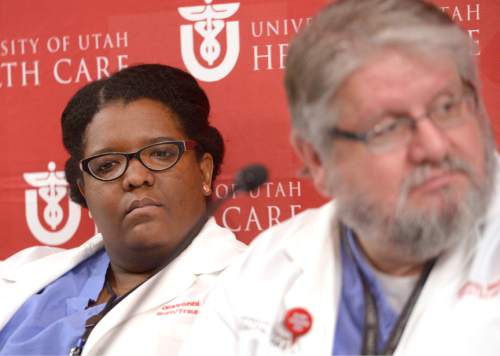 Leah Hogsten  |  The Salt Lake Tribune
Both doctors l-r Giavonni Lewis and Stephen Morris said they don't have an estimated time on when Wells and Empey will be released, but that's not unusual for burn victims. University of Utah burn unit doctors and the parents of Joseph Dresden Empey and Mason Wells, two of the four Mormon missionaries wounded in the March 22 Brussels airport terrorist bombing, held a press conference at the University of Utah hospital, Thursday, March 31, 2016,