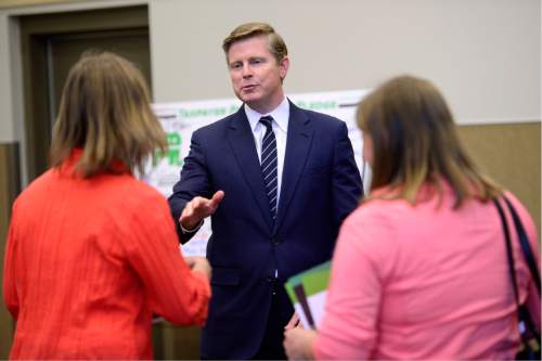 Scott Sommerdorf   |  The Salt Lake Tribune  
GOP gubernatorial candidate Jonathan Johnson greets two women who came to his meeting with state convention delegates in the Magna library, Thursday, April 14, 2016.