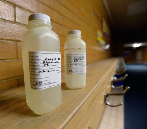 Al Hartmann  |  The Salt Lake Tribune 
Water samples from the Edgemont Elementary School's hallway drinking fountains taken early in the morning Wed. March 30.  The most common cause of lead poisoning is old corroded pipes that are basically rusting metals into the water. Lead pipes are now banned in the US, but at least 58 percent of Utah's schools were built before that law went into effect. In 1988, congress passed a law charging schools with identifying and rectifying lead contamination and pipe corrosion, but according to the EPA this law is essential impossible to enforce and is not widely implemented.