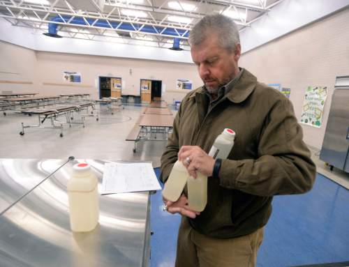 Al Hartmann  |  The Salt Lake Tribune 
Kevin Ray, risk management coordinator for Canyon School District gathers up four water samples and paperwork to be sent to a lab from early morning water samples taken from the Edgemont Elementary school's cafeteria and drinking fountains Wed. March 30.  The most common cause of lead poisoning is old corroded pipes that are basically rusting metals into the water. Lead pipes are now banned in the US, but at least 58 percent of Utah's schools were built before that law went into effect. In 1988, congress passed a law charging schools with identifying and rectifying lead contamination and pipe corrosion, but according to the EPA this law is essential impossible to enforce and is not widely implemented.