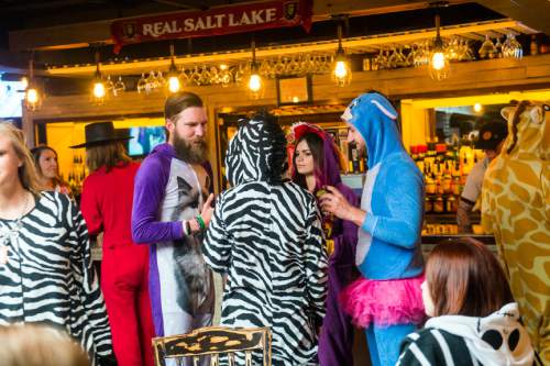Chris Detrick  |  The Salt Lake Tribune
Revelers participate in the Onesie Pub Crawl at Twist inSalt Lake City on Friday, April 15, 2016. The group was collecting donations to give to Youth Making A Difference Foundation while visiting several local bars in downtown Salt Lake City wearing onesie costumes.
