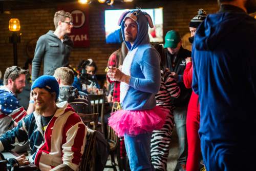 Chris Detrick  |  The Salt Lake Tribune
Revelers participate in the Onesie Pub Crawl at Twist in Salt Lake City on Friday, April 15, 2016. The group was collecting donations to give to Youth Making A Difference Foundation while visiting several local bars in downtown Salt Lake City wearing onesie costumes.