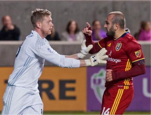 Michael Mangum  |  Special to the Tribune

Real Salt Lake forward Yura Movsisyan (14) scuffles with Colorado Rapids goalkeeper Zac MacMath (18) after MacMath shoved Movsisyan during their match at Rio Tinto Stadium in Sandy, UT on Saturday, April 9, 2016. RSL won 1-0.