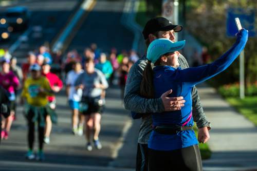Chris Detrick  |  The Salt Lake Tribune
A couple stops to take a selfie while running in the Salt Lake City marathon and half marathon Saturday April 16, 2016.