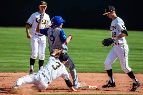 Chris Detrick  |  The Salt Lake Tribune
Cottonwood's Oliver Dunn (3) tags out Bingham's Parker Littlewood (9) during the game at Cottonwood High School Tuesday April 12, 2016. Cottonwood defeated Bingham 4-1.