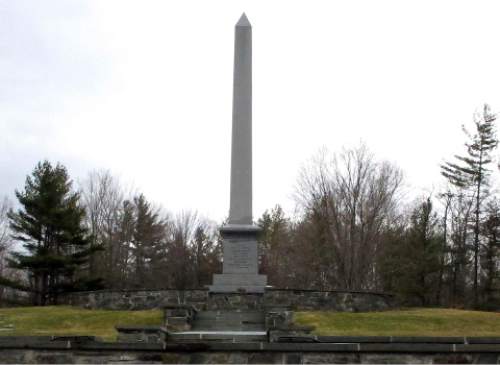 In this Tuesday, March 29, 2016 photo, an obelisk marks the birthplace of Mormonism founder Joseph Smith in Sharon, Vt. The NewVistas Foundation of Utah bought about 900 acres in four towns near Smith's birthplace and plans to buy more to build a large-scale development based on Smith's writings. (AP Photo/Lisa Rathke)