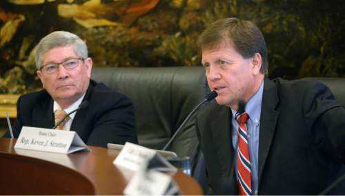 Al Hartmann  |  The Salt Lake Tribune
Senator David Hinkins, R- Orangeville, left, and Rep. Kevin Stratton, R-Orem, chairmen of the Commission for the Stewardship of Public Lands discuss Utah's funding the state's fight to take back federal land for Utah.   Democrats on the commission were incensed that no one aside from Hinkins, Stratton, the governor and attorney general have access to legal papers from lawyers who would lead the land fight that would cost the state nearly 14 million dollars.