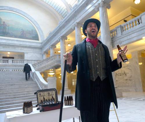 Al Hartmann  |  The Salt Lake Tribune
Actor for Western Values Project, portraying a snake oil salesman, mocks Rep. Ken Ivory, and Congressman Rob Bishop at the Capitol before the 9 a.m. meeting of the Commission for the Stewardship of Public Lands where a resolution condeming the Antiquities Act was expected to pass.  Also in contention as part of the Antiquities Act is a proposal before President Obama setting aside hundreds of thousands of acres in San Juan County for a Bear's Ears National Monument.