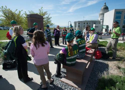 Steve Griffin  |  The Salt Lake Tribune


State employees, who are also members of the Community Emergency Response Team (CERT), talk about the day's drill at the Utah State Capitol after fire alarms were pulled as part of the annual earthquake drill the Great Utah ShakeOut. State employees evacuated the capitol campus and practiced reuniting at evacuation points. The Utah  Division of Emergency Management  and the state emergency response team participated in a variety of exercises in Salt Lake City, Thursday, April 21, 2016. The CERT members, who all work on Capitol Hill discussed how the drill went after employees reentered the buildings.