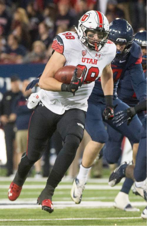 Rick Egan  |  The Salt Lake Tribune

Utah Utes tight end Harrison Handley (88) runs for a touchdown,  giving the Utes a 24-20 lead early in the second half,  in PAC-12 action against the Arizona Wildcats, in Tucson, Saturday, November 14, 2015.