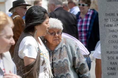 Al Hartmann  |  The Salt Lake Tribune
Paiute Tribal members, Circleville residents, Utah Division of State History, and LDS Church History representatives gather at the town park Friday April 22 for a dedication ceremony for a new memorial recognizing the men, women and children of the Koosharem Band of the Paiute Indian Tribe killed during the Circleville Massacre in late April 1866.