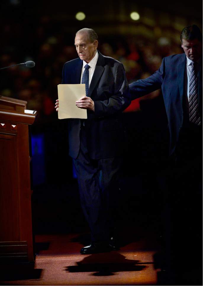 Scott Sommerdorf   |  The Salt Lake Tribune  
President Thomas S. Monson is helped to the podium prior to speaking at the morning session of the 186th annual General Conference of the LDS Church, Sunday, April 3, 2016.