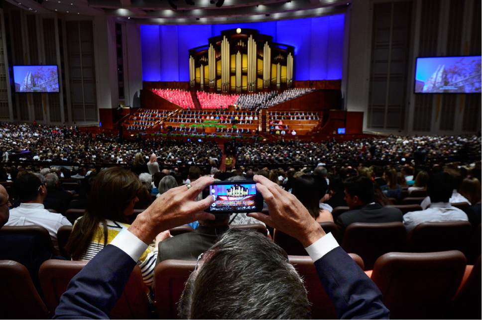 Scott Sommerdorf   |  The Salt Lake Tribune  
A man makes a photo of the conference center prior to the afternoon session of the 186th annual General Conference of the LDS Church, Sunday, April 3, 2016.