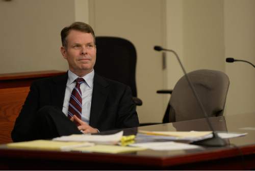 Francisco Kjolseth | The Salt Lake Tribune
John Swallow sits patiently in court as the defense and prosecution speak with the judge in her chambers at the Matheson courthouse on Tuesday, April 12, 2016. Swallow's team was asking the judge to order the Salt Lake County district attorney to seek additional evidence from the FBI.