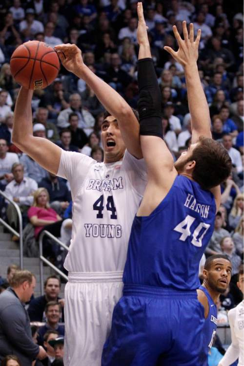 BYU center Corbin Kaufusi (44) and Creighton forward Zach Hanson (40) collide during an NCAA college basketball game in the men's NIT, Tuesday, March 22, 2016, in Provo, Utah. BYU won 88-82. (Sammy Jo Hester/Daily Herald via AP)