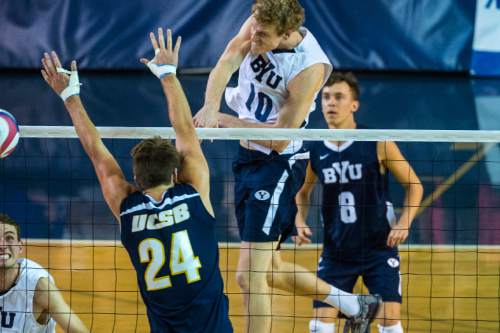 Chris Detrick  |  The Salt Lake Tribune
BYU's Jake Langlois (10) spikes past UCSB's Henri Cherry (24) during the MPSF tournament semifinal at Smith Fieldhouse Thursday April 21, 2016.