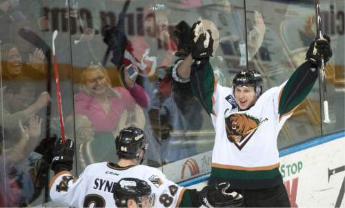 Rick Egan  |  The Salt Lake Tribune

Utah Grizzlies Ryan Hayes (11) celebrates his goal along with Utah Grizzlies T.J. Syner (84), in the third period. Hayes' goal gave the Grizzlies a 3-0 lead in ECHL Division Semi-Final hockey action, Utah Grizzlies vs. The Idaho Steelheads, at the Maverik Center, Monday, April 27, 2015.