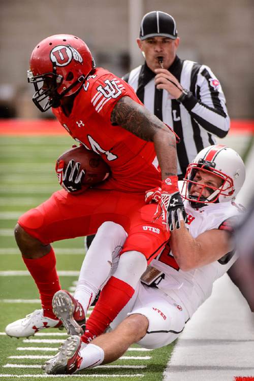 Trent Nelson  |  The Salt Lake Tribune
A.J. Cecil tackles Kenric Young at the University of Utah's Red-White spring football game at Rice-Eccles Stadium in Salt Lake City, Saturday April 23, 2016.