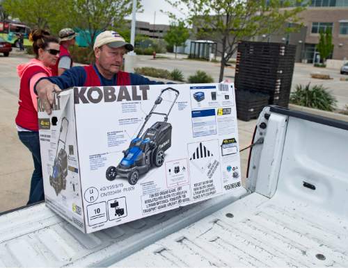 Lennie Mahler  |  The Salt Lake Tribune
Frank Sanguinette loads a new lawnmower into a truck as Lowe's and the DEQ offered new, environmentally friendly gas-powered lawnmowers at a discount during their CARROT program on Saturday.