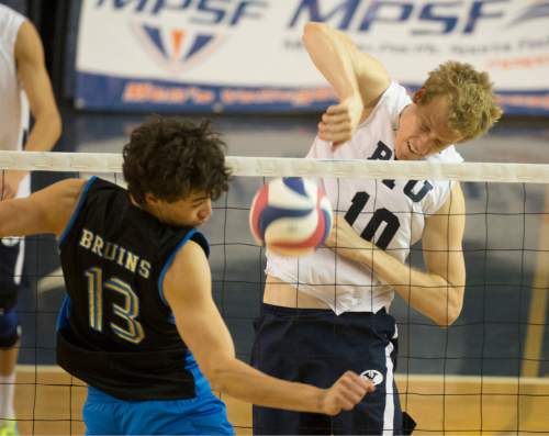 Rick Egan  |  The Salt Lake Tribune

Brigham Young Cougars Jake Langlois (10) hits the ball past UCLA Bruin defenders UCLA Bruins Micah Ma'a (13), in BYU's victory in the Mountain Pacific Sports Federation Volleyball Championship game,  in tournament action at the Smith Field House in Provo, Saturday, April 23, 2016.