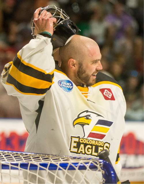 Rick Egan  |  The Salt Lake Tribune

Colorado Eagles goalie Clarke Saunders (33) puts his mask back on after it was knocked off his head for the second time of the game, in ECHL playoff hockey action at the Maverik Center, Sunday, April 24, 2016.