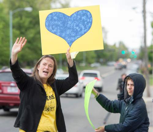 Rick Egan  |  The Salt Lake Tribune

Deanna Holland leads the group, as the songs, during a pro-life protest outside Planned Parenthood in Salt Lake, Saturday, April 23, 2016.