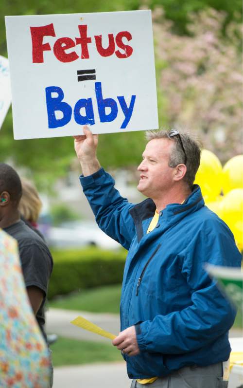 Rick Egan  |  The Salt Lake Tribune
Bruce Rigby founder of Pro Life Utah, sings with the group, during a pro-life protest outside Planned Parenthood in Salt Lake on Saturday.
