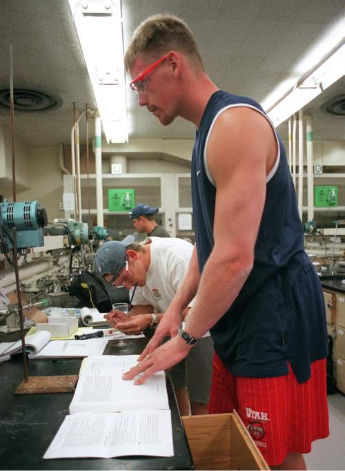Trent Nelson  |  The Salt Lake Tribune

Former Utah (now NBA) basketball player Michael Doleac stands head and shoulders above his chemistry lab classmates at the University of Utah on July 17, 2001. Doleac has five classes to finish in order to graduate.