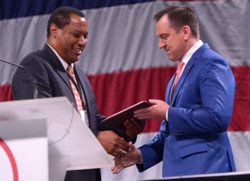 Leah Hogsten  |  The Salt Lake Tribune
"He went to war for us," said Utah Republican Party Chairman James M. Evans who gives the Chairman Award of Valor to Utah House Speaker Greg Hughes for his fight against SB54 during the 2016 legislative session  at the Utah Republican Convention, Saturday, April 23, 2016, at Salt Palace Convention Center.