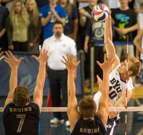 Rick Egan  |  The Salt Lake Tribune

Brigham Young Cougars Jake Langlois (10) hits the ball past
UCLA Bruin defenders, in BYU's victory in the Mountain Pacific Sports Federation Volleyball Championship game,  in tournament action at the Smith Field House in Provo, Saturday, April 23, 2016.