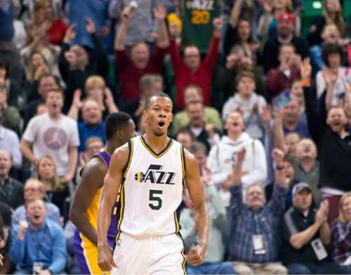 Lennie Mahler  |  The Salt Lake Tribune

Jazz guard Rodney Hood celebrates a three-point basket during a game against the Los Angeles Lakers at Vivint Smart Home Arena in Salt Lake City, Monday, March 28, 2016.