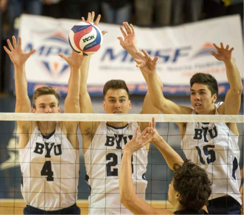 Rick Egan  |  The Salt Lake Tribune

Brigham Young Cougar defenders, Leo Durkin (4), Evan Chang (3) and Brenden Sander (15) go up for a block, in BYU's victory in the Mountain Pacific Sports Federation Volleyball Championship game,  in tournament action at the Smith Field House in Provo, Saturday, April 23, 2016.