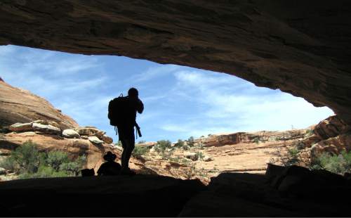 Al Hartmann  |  The Salt Lake Tribune 
Backpackers take shade under a sandstone alcove in a canyon on Cedar Mesa in San Juan County.  The area is included for a proposed Bears Ears National Conservation Area.