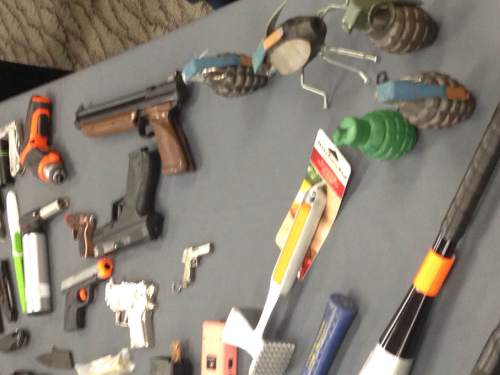Lee Davidson  |  The Salt Lake Tribune

A table full of prohibited items seized recently at Salt Lake City International Airport includes inert or fake grenades, guns, knives, clubs and tools.