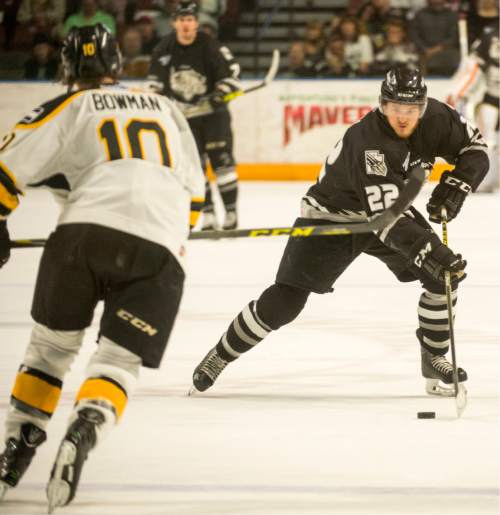 Rick Egan  |  The Salt Lake Tribune

Utah Grizzlies forward Matt Berry (22) looked for shot, as Colorado Eagles defender Colin Bowman (10) defends, in ECHL playoff hockey action at the Maverik Center ,Sunday, April 24, 2016.