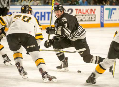 Rick Egan  |  The Salt Lake Tribune

Utah Grizzlies defenceman Mike Ratchuk (7) goes in for a shot, as Colorado Eagles defender Boe Channing (28) defends in ECHL playoff hockey action at the Maverik Center ,Sunday, April 24, 2016.