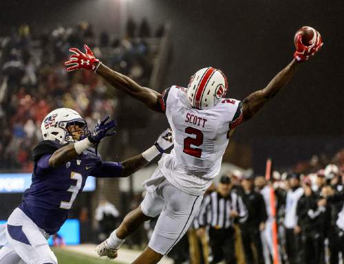 Trent Nelson  |  The Salt Lake Tribune
Utah Utes wide receiver Kenneth Scott (2) reaches out for a one-handed grab as the University of Utah faces the University of Washington, NCAA football at Husky Stadium in Seattle, Saturday November 7, 2015. Defending is Washington Huskies defensive back Darren Gardenhire (3).