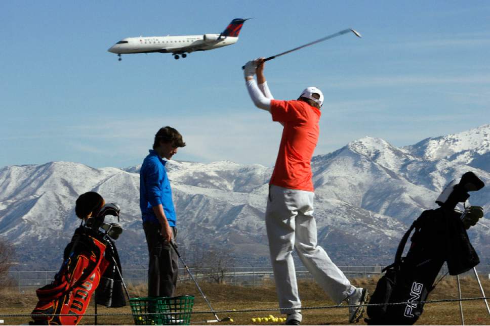 Scott Sommerdorf  |  The Salt Lake Tribune
With snow still in the mountains, and temperatures around 60, the nice weather brought Wilson Lamb, (left) and Davis Kinney out to the practice tee at Wingpointe Golf Course near the Salt Lake International Airport, Sunday, February 12, 2011.
