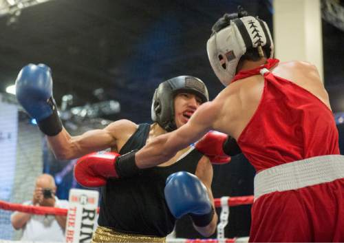 Rick Egan  |  The Salt Lake Tribune

Buba Siliga, State Street (red) fights Jorge Orozo,  Louies (blue)in the 201+ division, in the Golden Gloves Boxing Rocky Mountain Regionals, at the South Towne Expo Center in Sandy, Saturday, April 30, 2016.