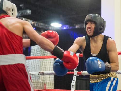 Rick Egan  |  The Salt Lake Tribune

Buba Siliga, State Street (red) fights Jorge Orozo,  Louies (blue)in the 201+ division, in the Golden Gloves Boxing Rocky Mountain Regionals, at the South Towne Expo Center in Sandy, Saturday, April 30, 2016.