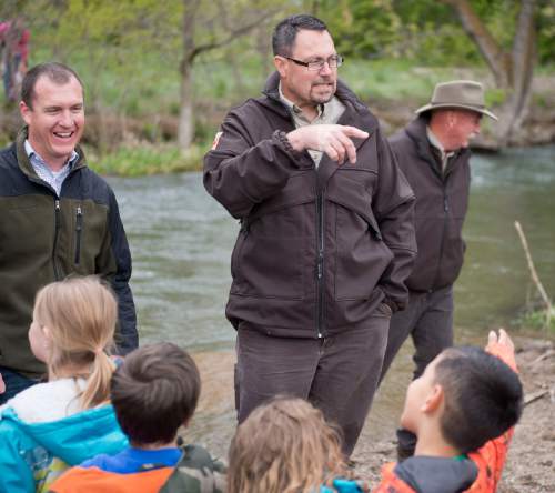 Lennie Mahler  |  The Salt Lake Tribune

Paul Burnett, left, of Trout Unlimited, and Paul Thompson of the Division of Wildlife Resources speak to DaVinci Academy students before they release trout into the Ogden River on Friday, April 29, 2016.