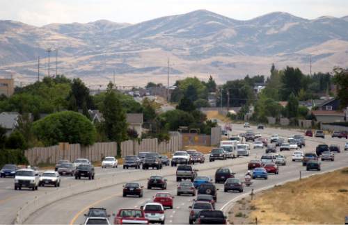 Trent Nelson  |  Tribune file photo
Traffic moves south along the Bangerter Highway in 2003.