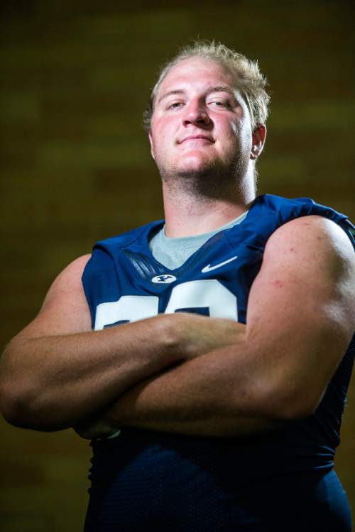 Chris Detrick  |  The Salt Lake Tribune
Brigham Young Cougars offensive lineman Ryker Mathews (72) poses for a portrait Wednesday August 12, 2015.