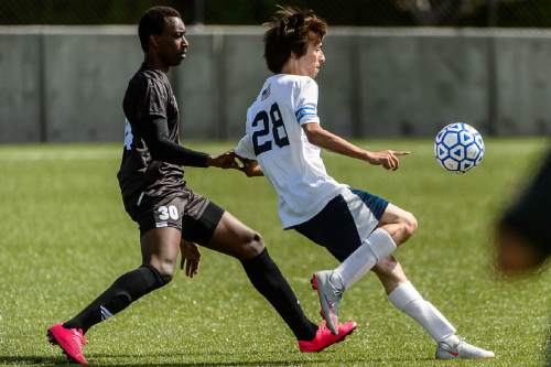 Trent Nelson  |  The Salt Lake Tribune
Layton Christian's Ivan Kamili (30) and American Prep's Pablo Gonzalez (28) in the first round of the boys' soccer Class 2A postseason, Wednesday May 4, 2016.