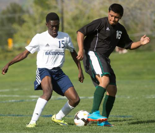 Rick Egan  |  The Salt Lake Tribune

Michael Adjei-Poku (15) Waterford, goes for the ball along with Jose Mendoza (16) Wendover, in prep soccer action in Sandy, Wednesday, May 4, 2016.