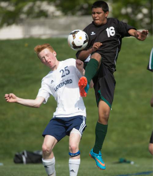 Rick Egan  |  The Salt Lake Tribune

Tate Reynolds (25) Waterford, collides with Jose Mendoze, (16) Wewndover,in prep soccer action in Sandy, Wednesday, May 4, 2016.