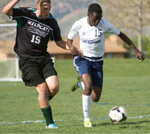 Rick Egan  |  The Salt Lake Tribune

Michael Adjei-Poku (15) Waterford, goes for the ball along with Juan Ibarra (15) Wendover, in prep soccer action in Sandy, Wednesday, May 4, 2016.